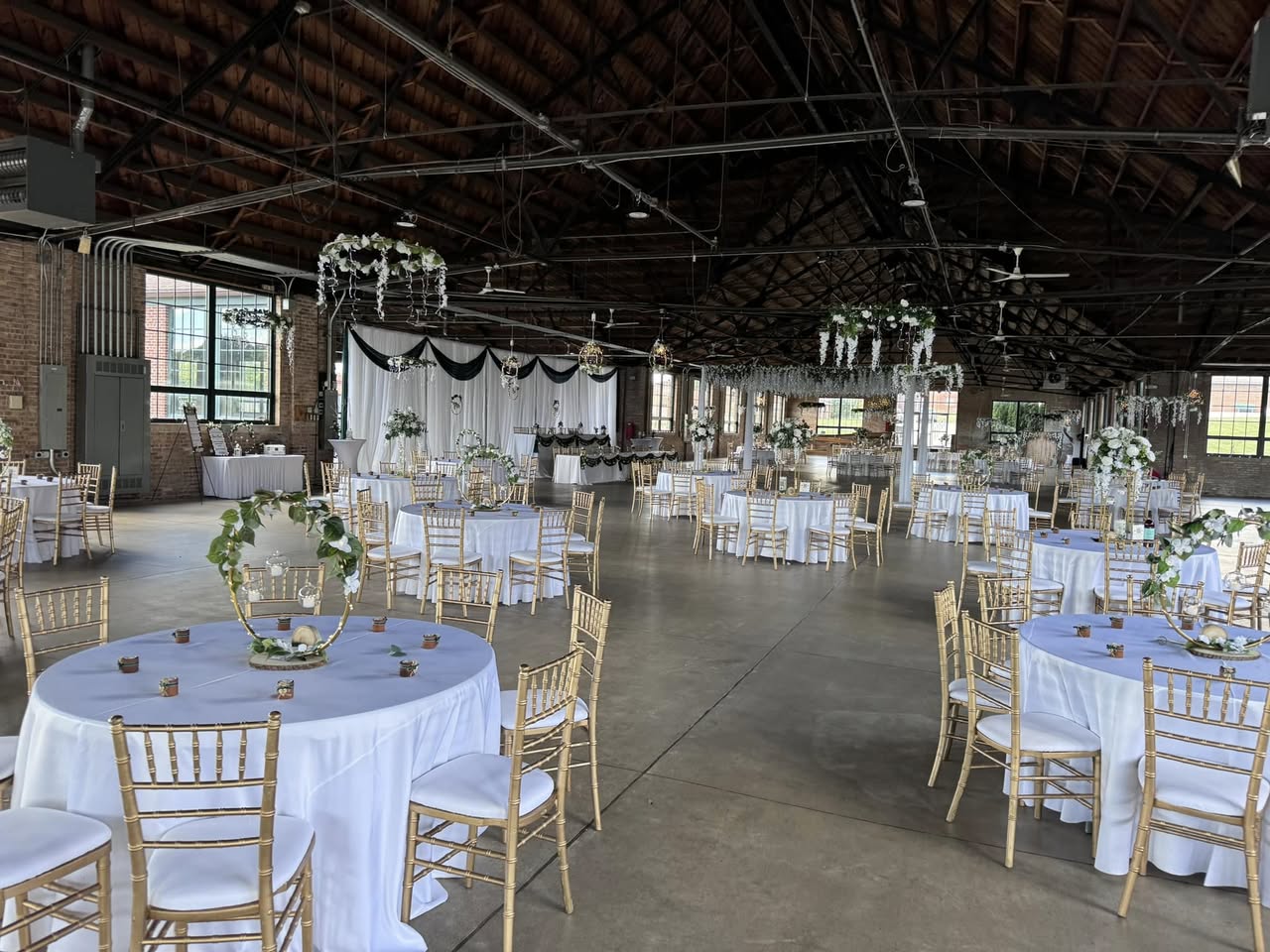 Wedding ceremony setup with white chairs and aisle runner at Lake County Fairgrounds